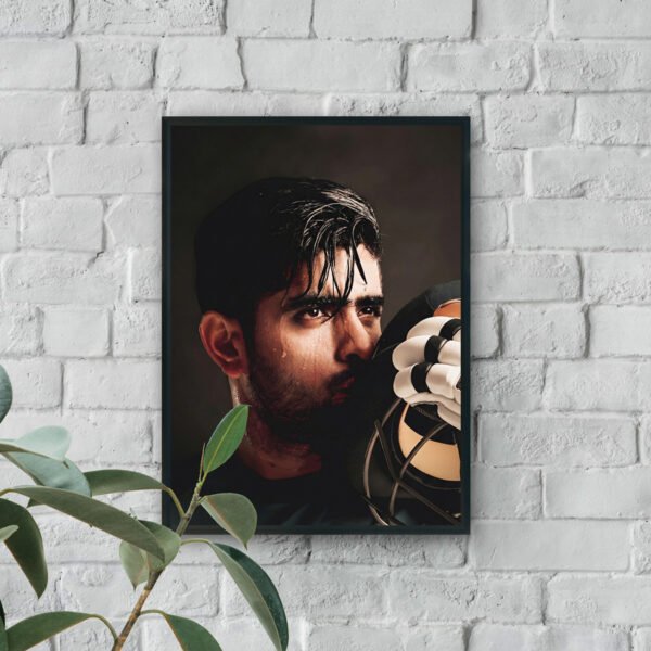 Close-up portrait of a sweaty boxer holding his glove near his face with an intense, focused expression.