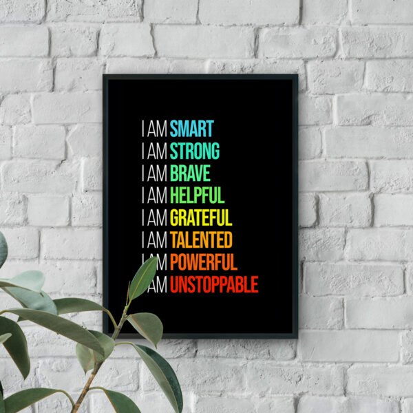 Motivational wall art with colorful “I AM” affirmations including smart, strong, brave, grateful, powerful, and unstoppable on a black background.