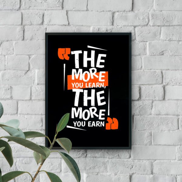 Motivational typography wall art with the quote The more you learn, the more you earn in white and orange text on a black background.
