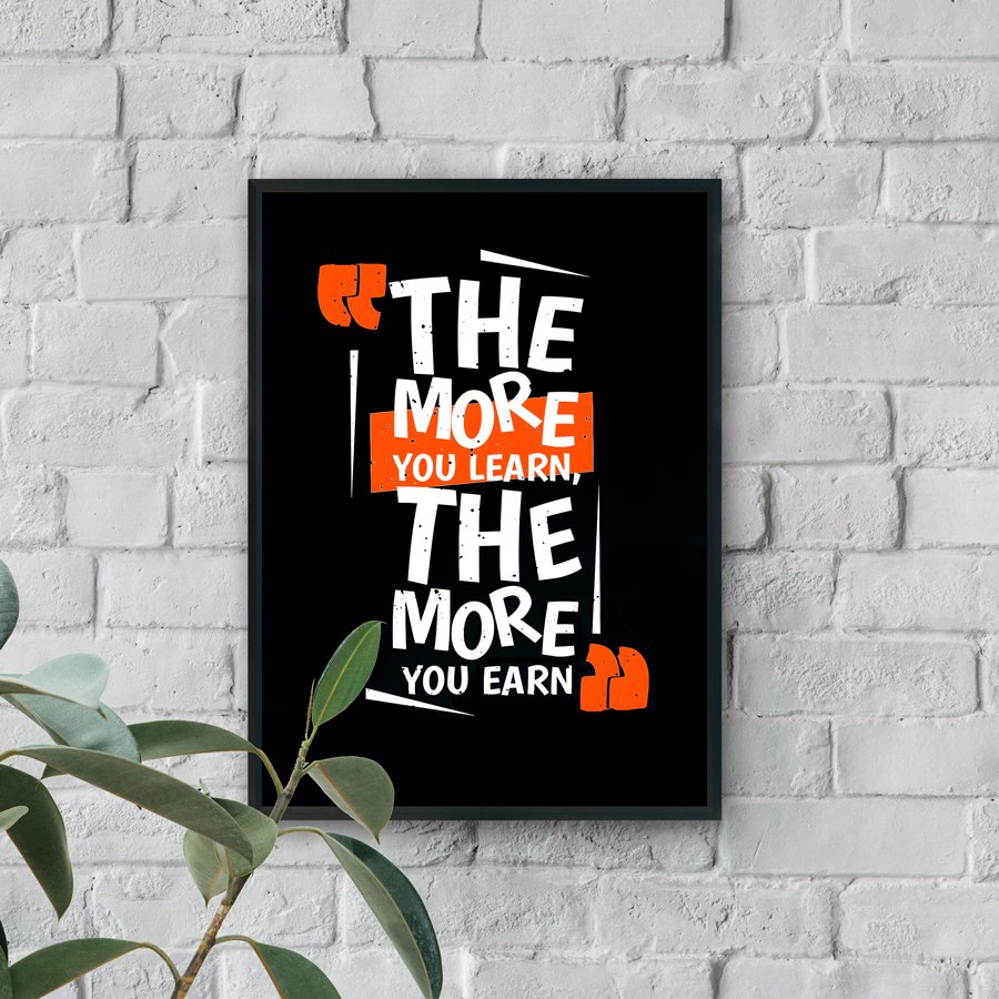 Motivational typography wall art with the quote The more you learn, the more you earn in white and orange text on a black background.