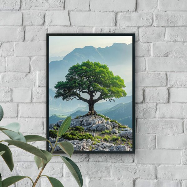 Lone green tree on rocky hilltop with layered mountain landscape in soft atmospheric light.