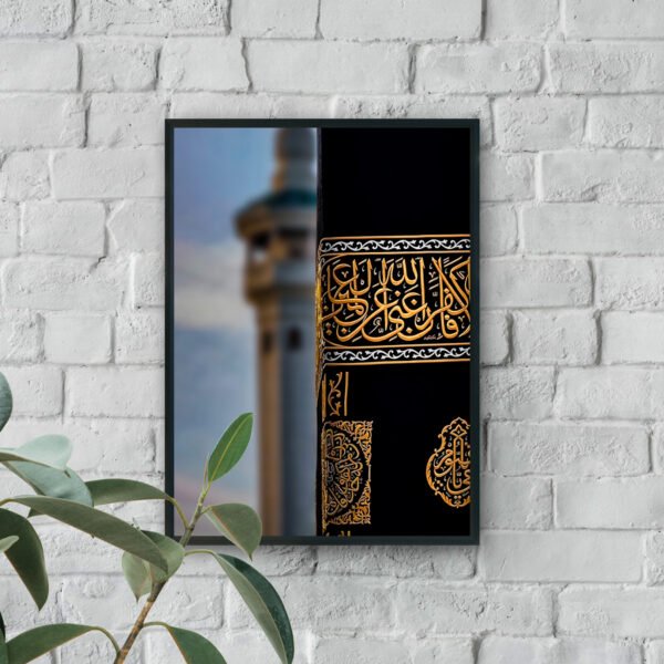 Close-up of the Kaaba’s black cloth with intricate golden Arabic calligraphy and decorative details.