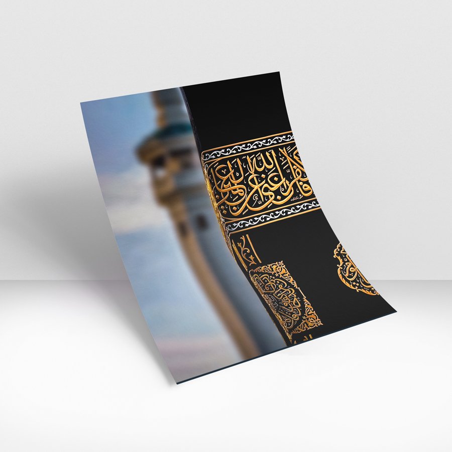 Close-up of the Kaaba’s black cloth with intricate golden Arabic calligraphy and decorative details.